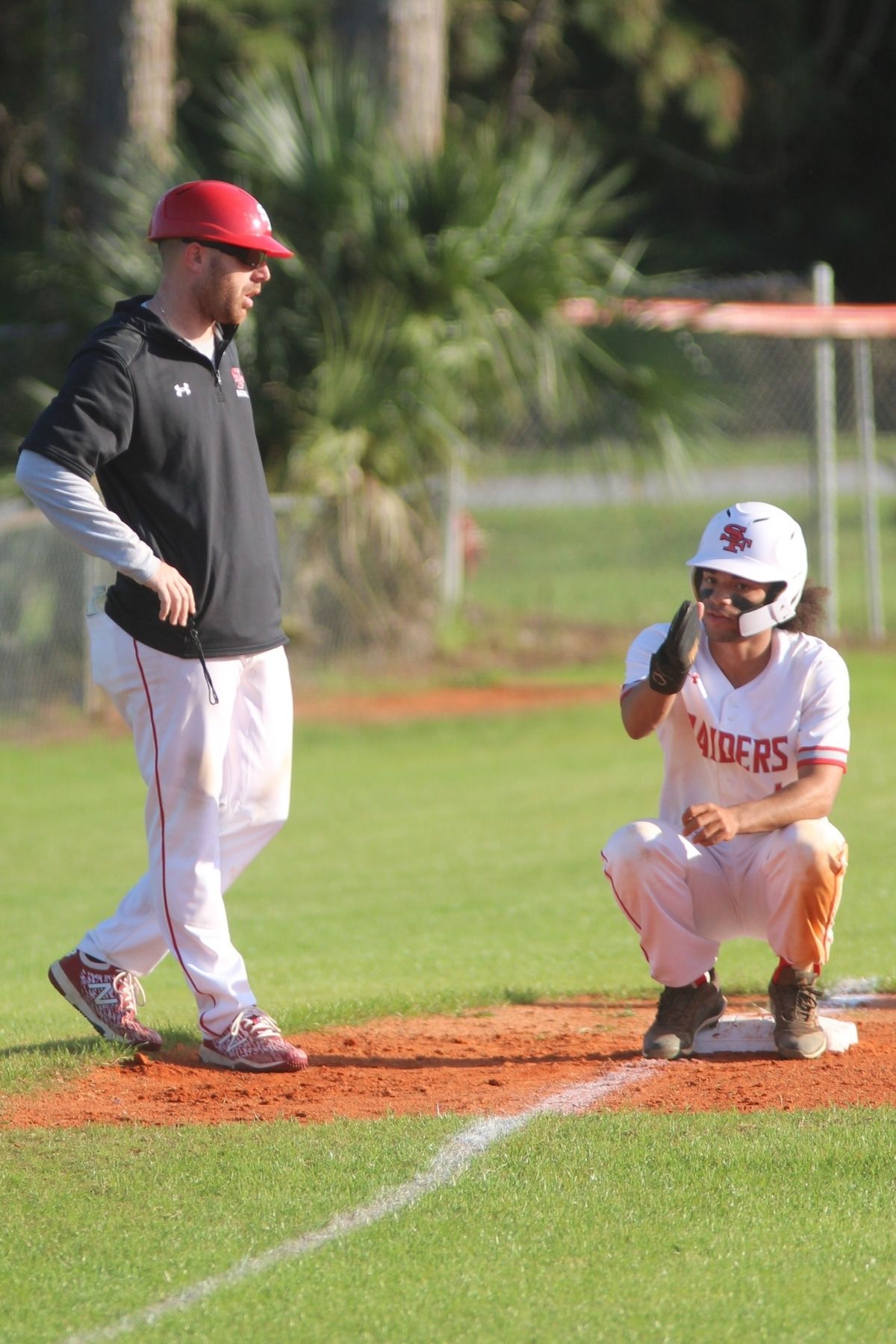 Santa Fe baseball coach Travis Yeckring and Devan Mitchum