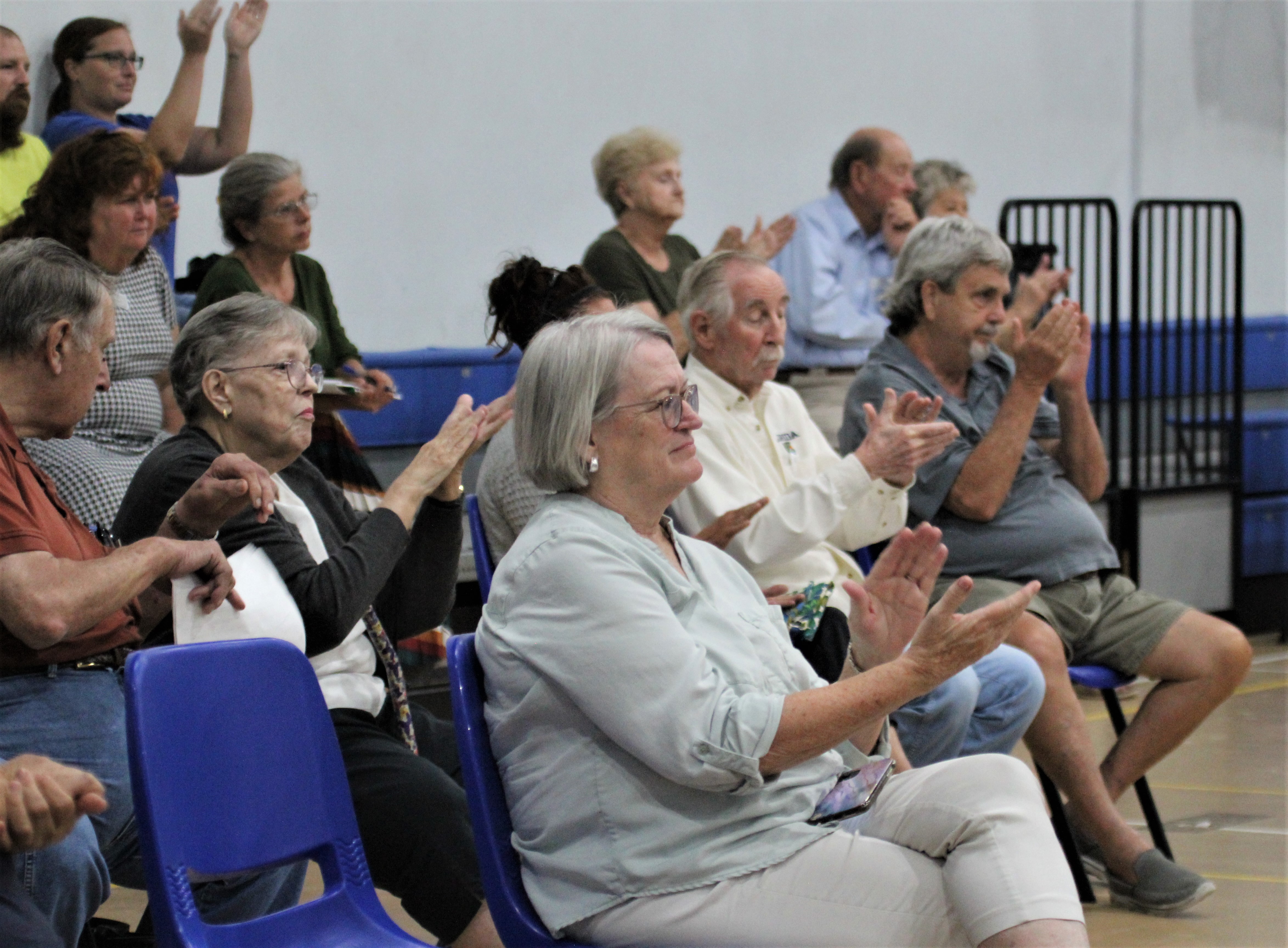 Audience applauds after joint commission meeting