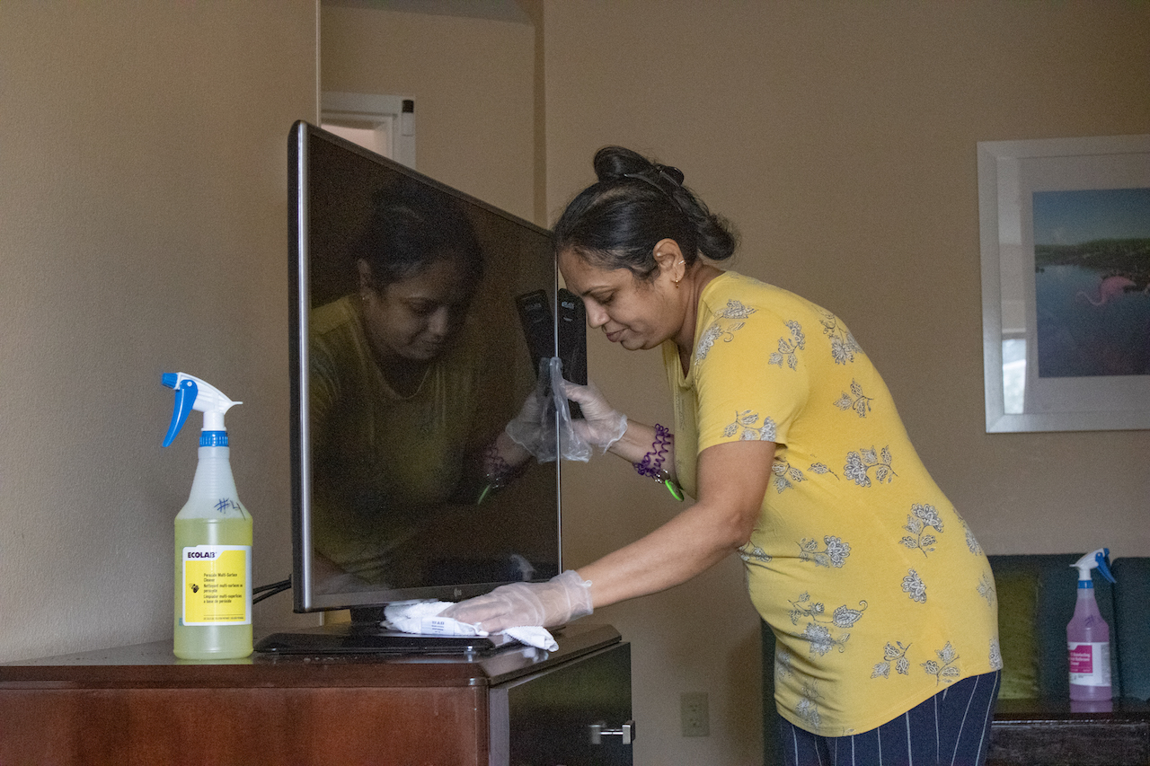 Rita Patel cleans a SpringHill Suites room