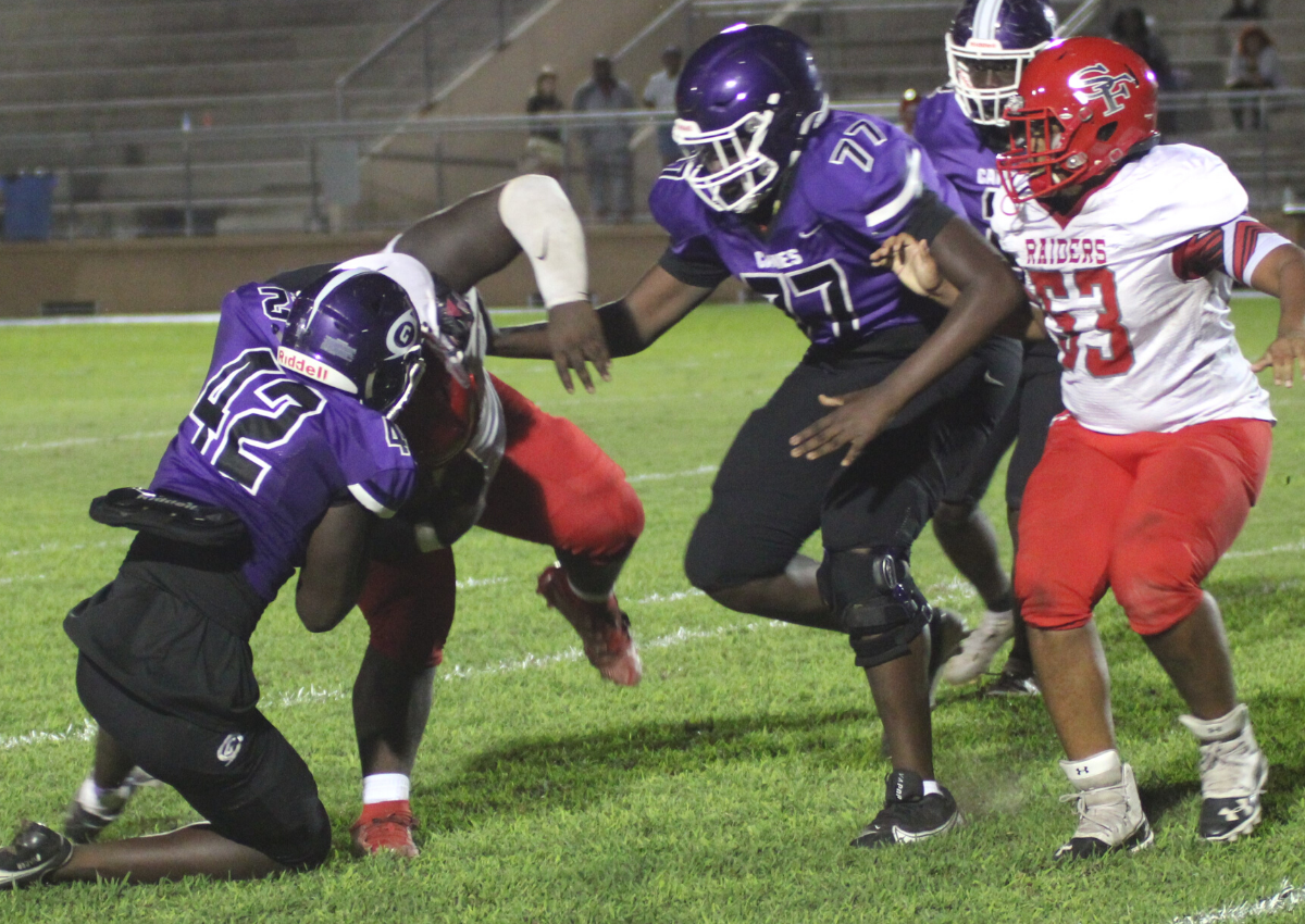 Gainesville LB Brandon Bowden tackles SF RB Kenyon Carter