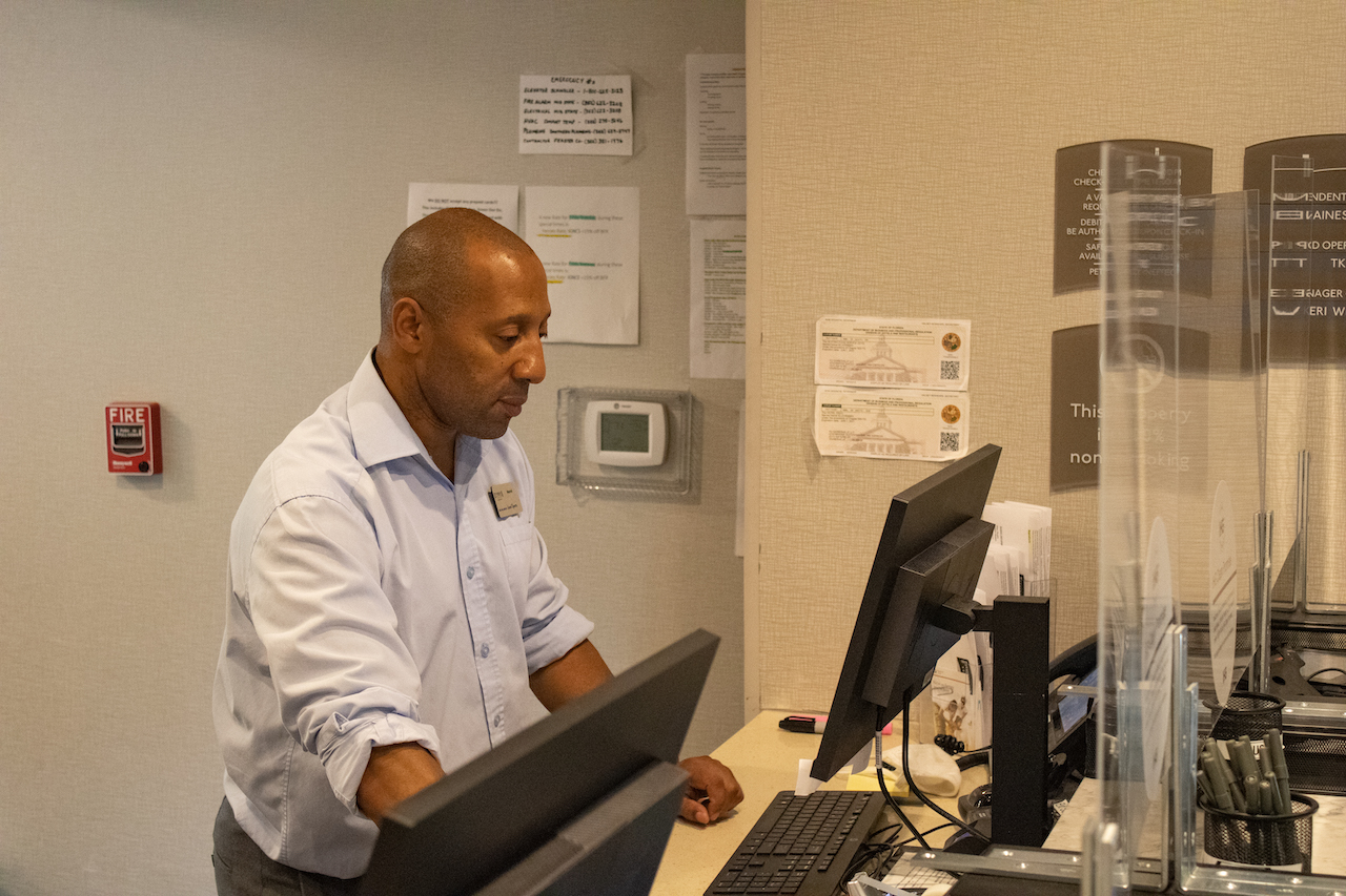 Marcel Carter works the front desk at Staybridge Suites in Gainesville