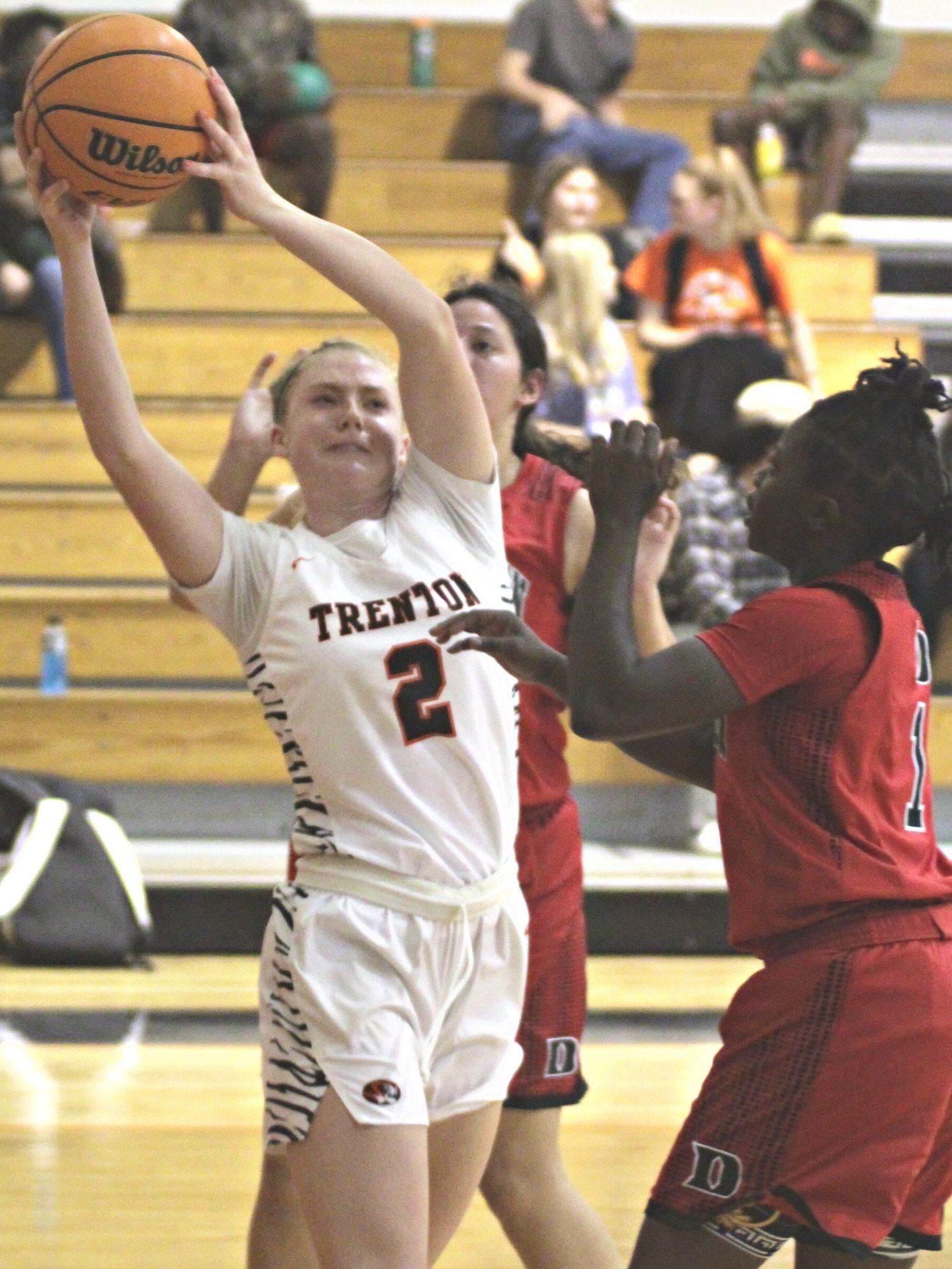 Trenton's Bri Becker rebounding basketball