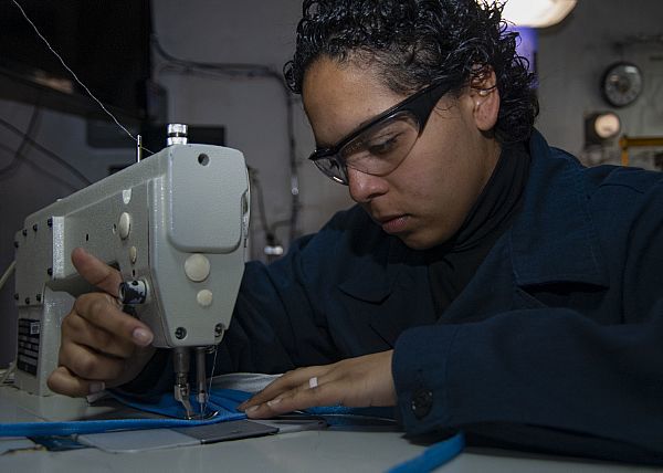 MEDITERRANEAN SEA (April 7, 2020) Aircrew Survival Equipmentman Airman Paula Guanco, from Santos, Brazil, sews medical-grade cloth face masks in the aviation paraloft aboard the aircraft carrier USS Harry S. Truman (CVN 75) in the Mediterranean Sea, April 7, 2020. The Harry S. Truman Carrier Strike Group is conducting operations in U.S. 6th Fleet to support maritime security operations in international waters, alongside our allies and partners. Truman has spent at least one day underway for 30 of the last 34 months, in direct support of global security around the world. (U.S. Navy Mass Communication Specialist Seaman Kelsey Trinh/Released)