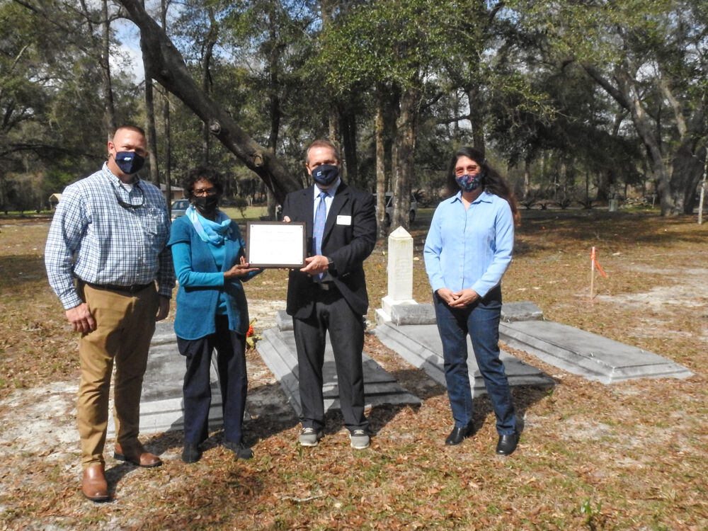 L-R: Todd Martin, Clay Electric member relations, Roberta Lopez, president of BEMCRO, Tray Adkins, district manager Clay Electric, and Gina Hawkins of Keep Alachua County Beautiful