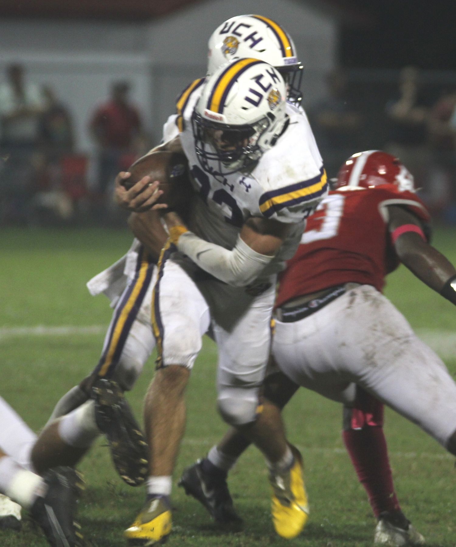 UC Caleb Crawford plows through DC Makyll Walker