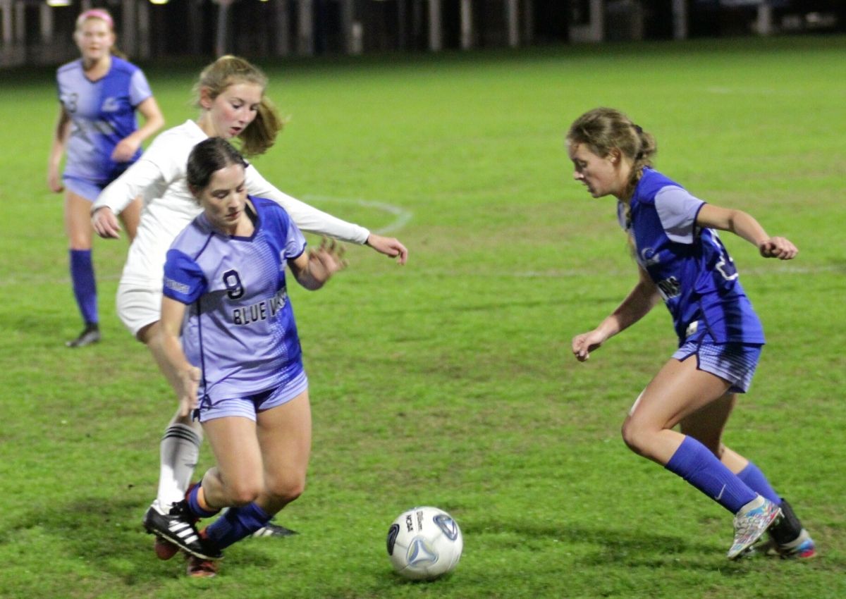 PK Yonge's Sally Schackow (9) and Chloe Westbrooks go for ball