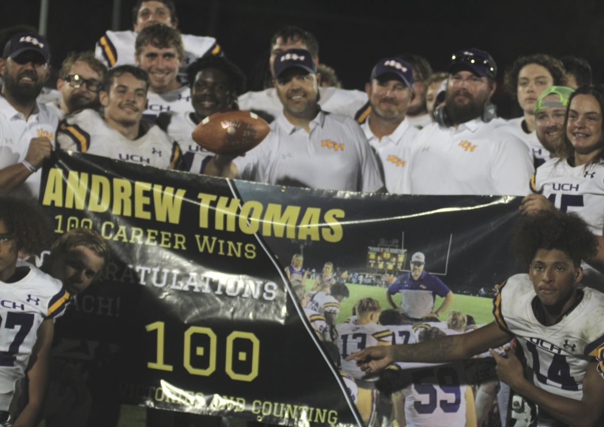 UC coach Andrew Thomas 100th win