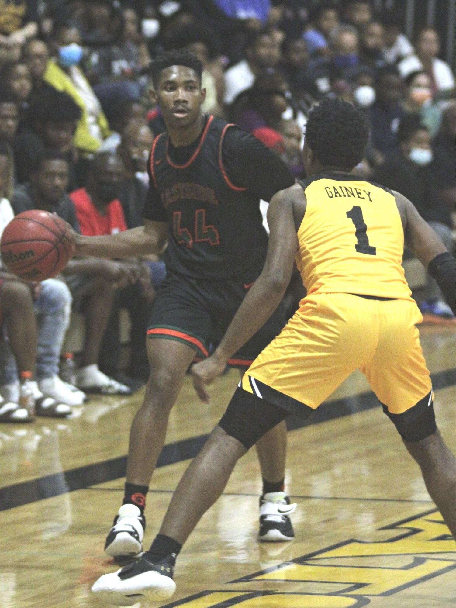 Eastside's Calvin Cooper looks for a pass around Buchholz's Tyler Gainey