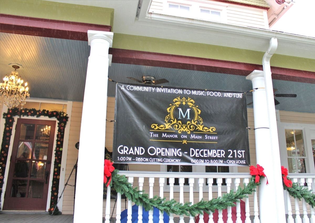 The Manor on Main Street grand opening sign