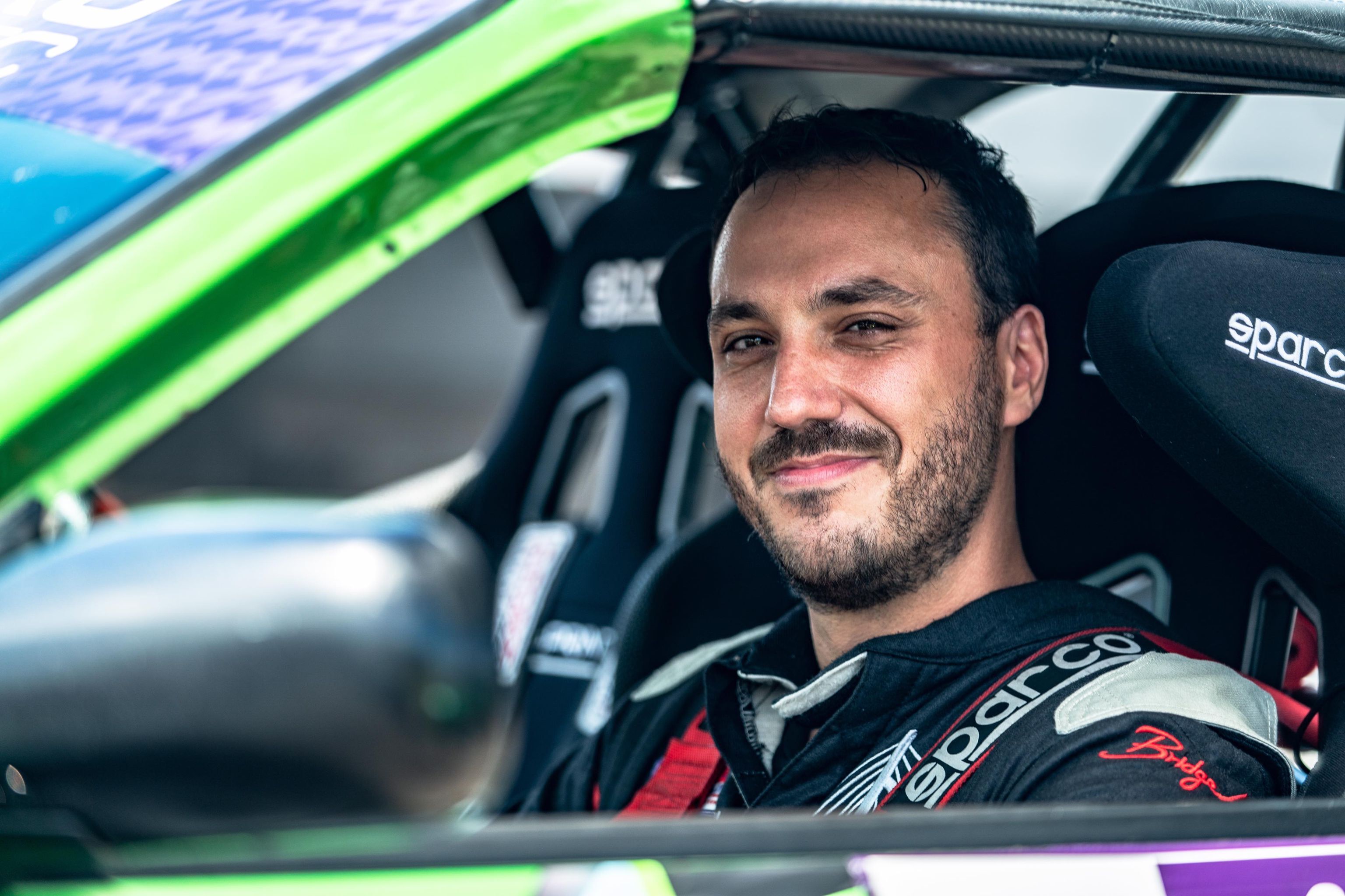 Alex Schlagel smiling in vehicle