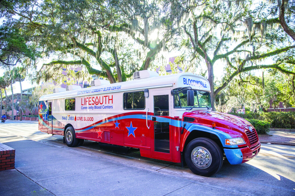 LifeSouth Blood Mobile bus on shaded road