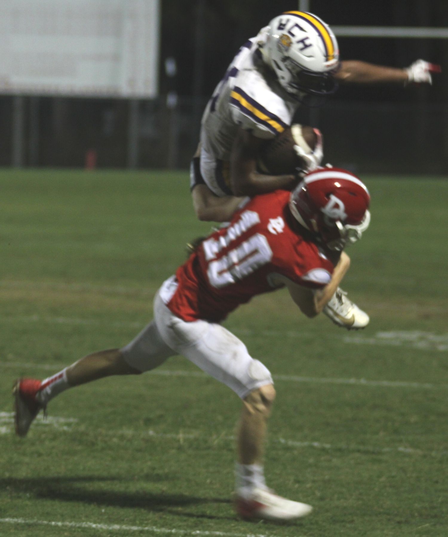 UC Daylyn Diston tackled by DC Luke Thomas