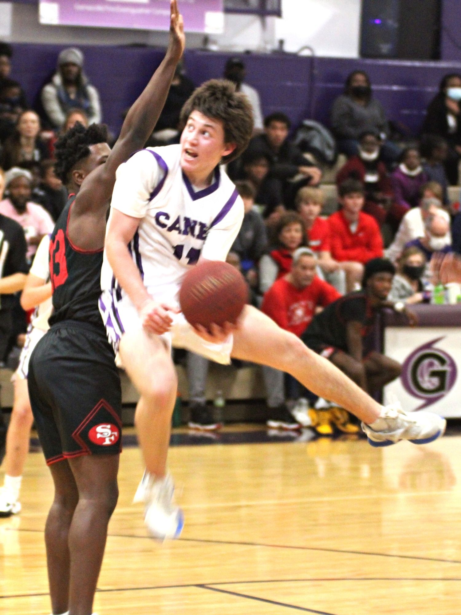 Gainesville's Seth Childers drives on Santa Fe's Timothy Bailey