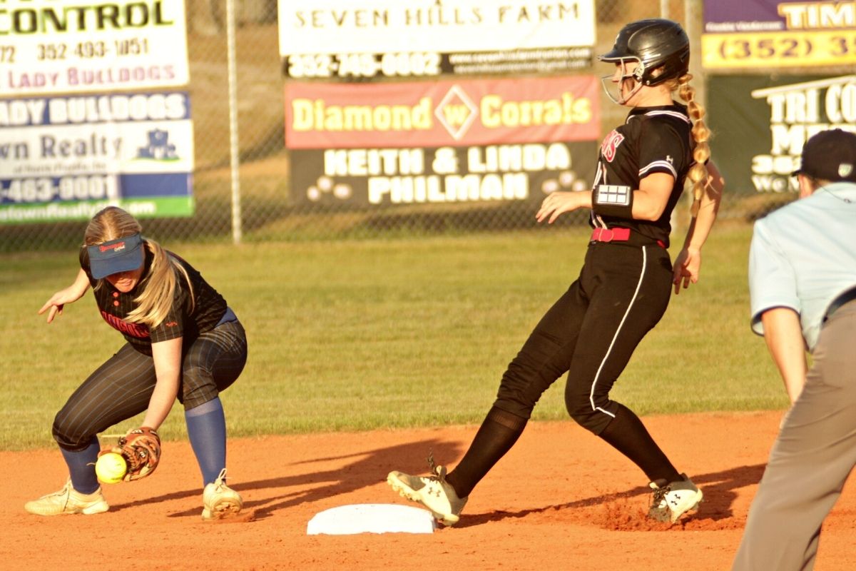 Branford's Joslyn Barrs drops ball and Fort White's Kaitlyn Suggs safe at 2b