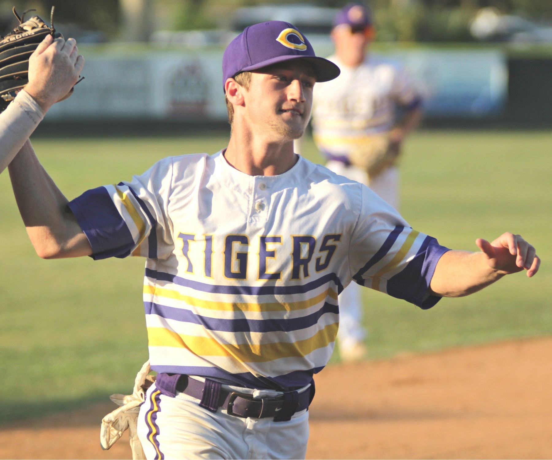 Columbia's Matt Dumas congratulated after 1st inning throw out at home