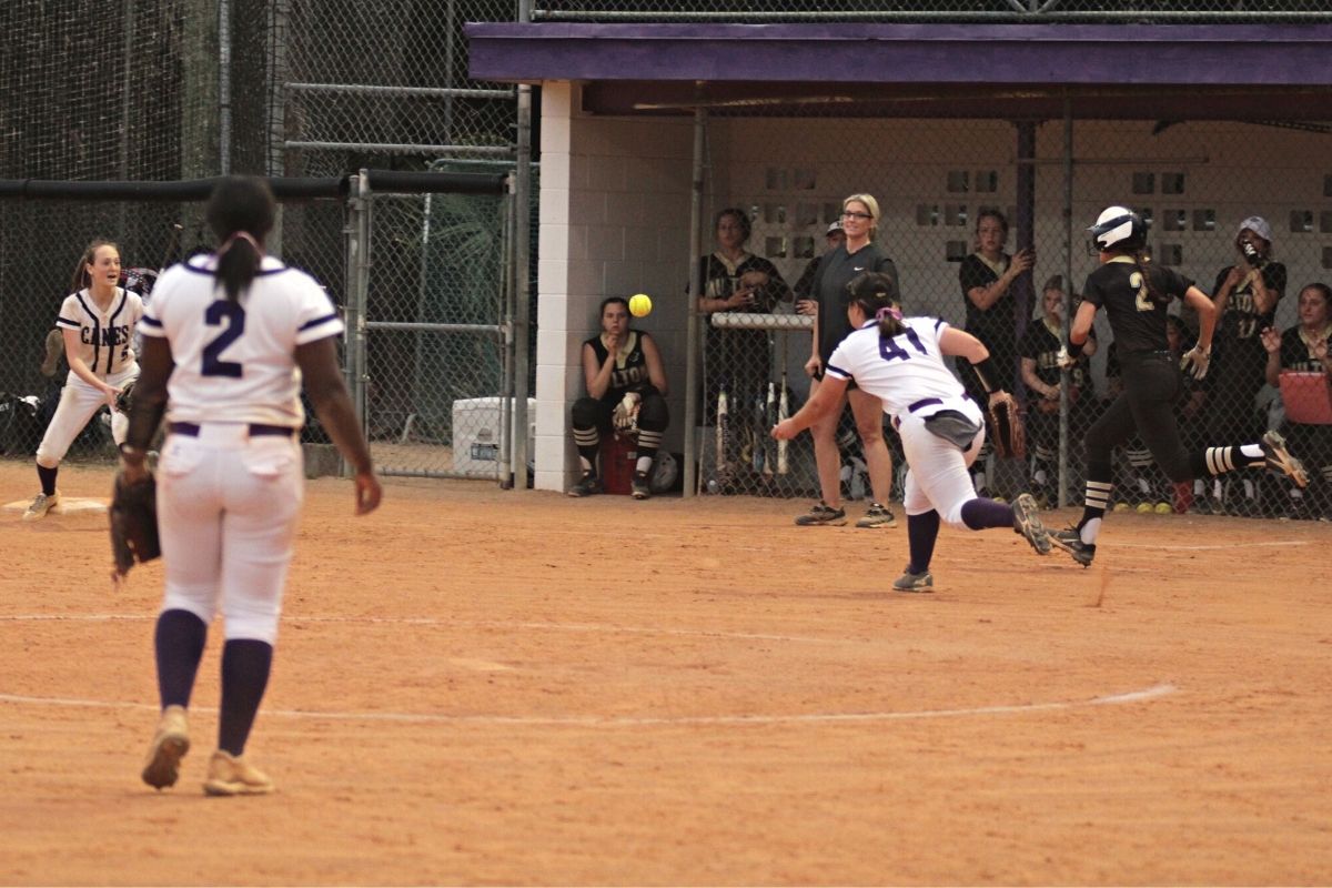 Kyra Hornsby (41) tosses to Clare Cavallari for 3rd out fourth inning