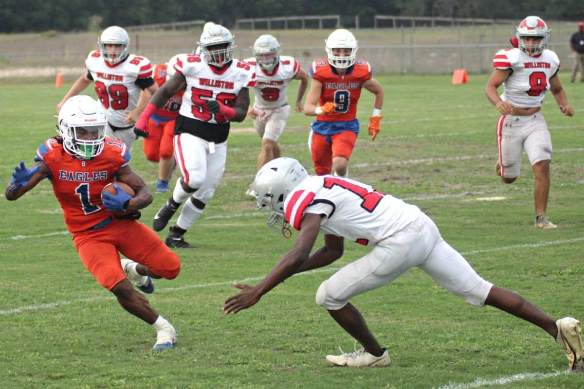 Bronson's Donteau Jenkins jukes past Williston's Jharod Gray