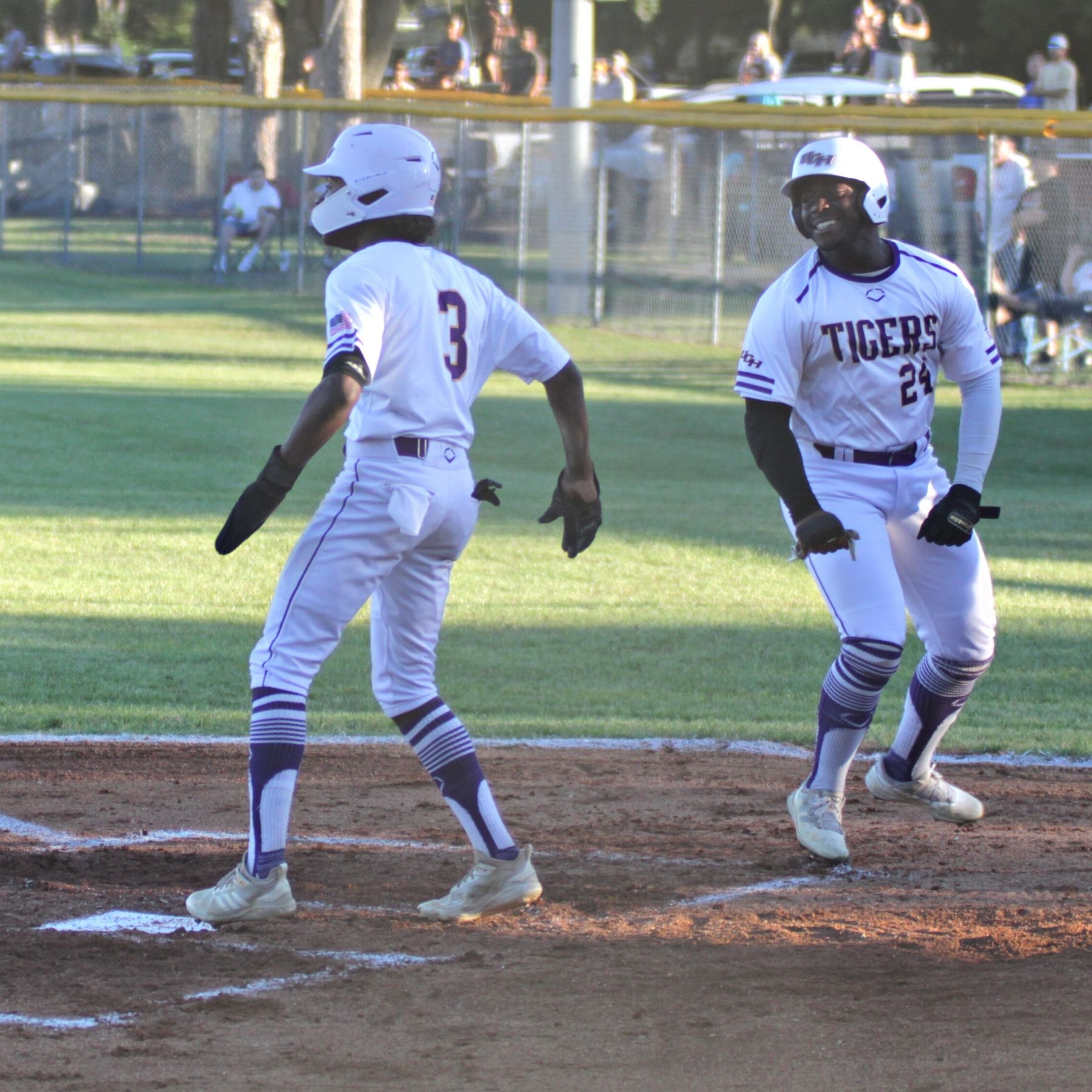 Union County's Quinten Rawls (3) and Kyler Cohen (24) score in bottom of first