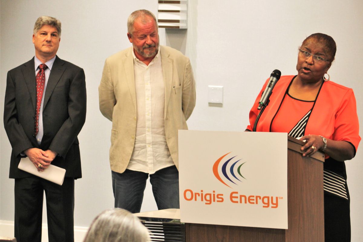 Archer resident Jeraldine McMillan with Nathan Skop and Johan Vanhee, center