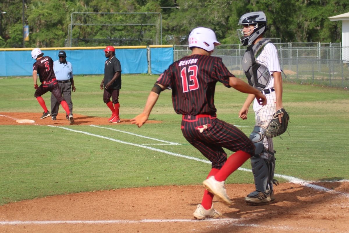 Williston's Nolan Benton scores on a Miles Beville double