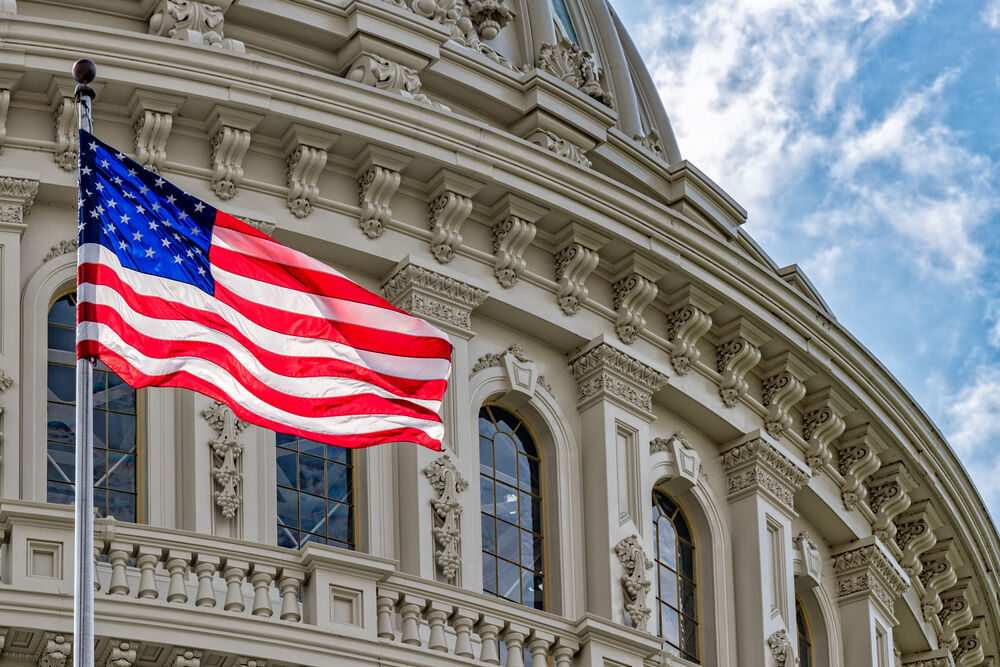 U.S. Capitol dome with waving American flag