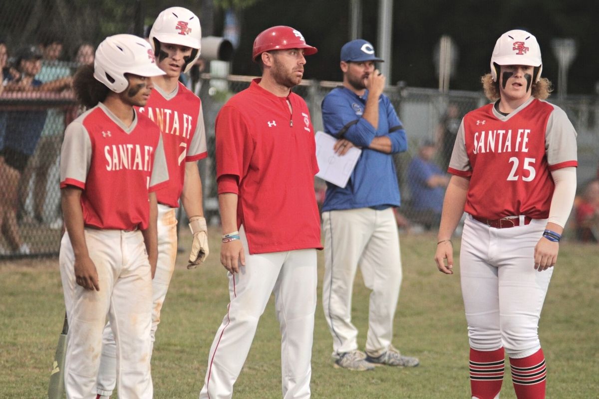 Santa Fe coach Travis Yeckring with offense during Clay pitching change