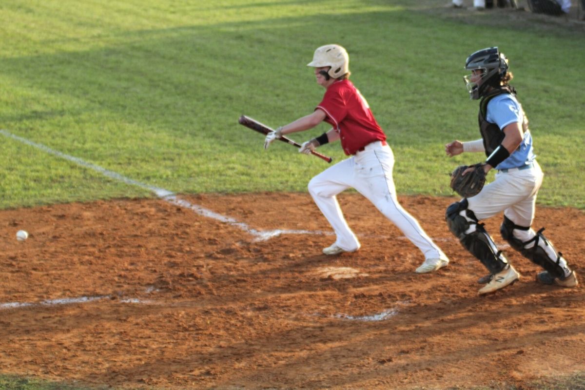 Dixie County Dyllan Corbin lays down bunt in 3rd inning