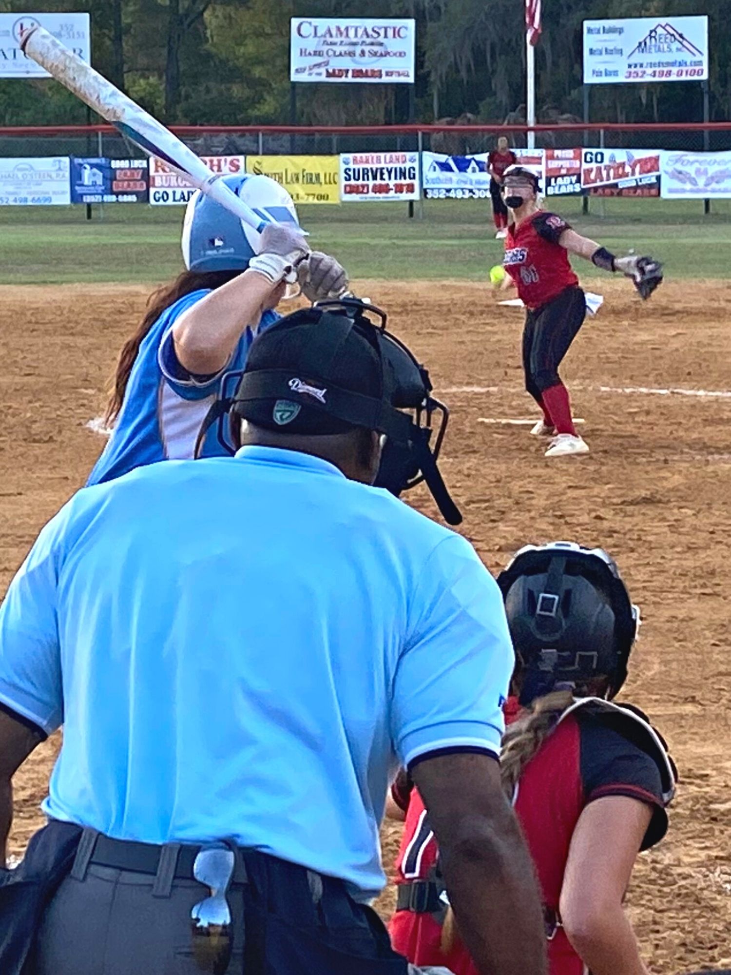 Chiefland’s Rayna Merz at bat vs. Dixie County pitcher Madisyn Langford and catcher Peyton Hatcher