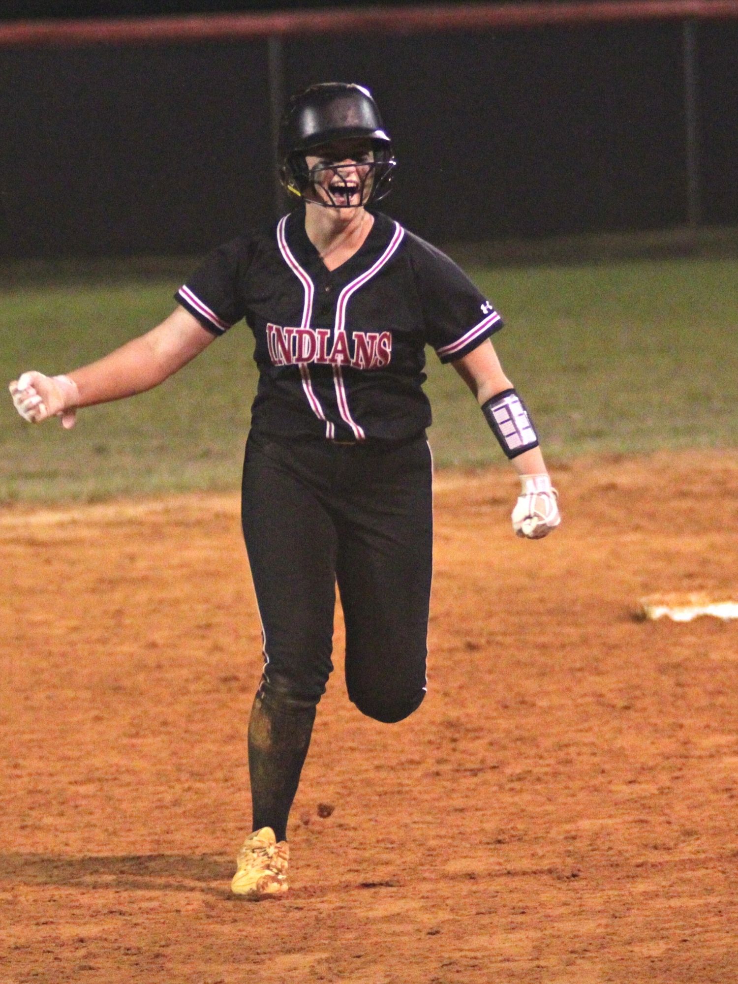 Fort White Kadence Compton after hitting 2-run HR against Union County in regional championship