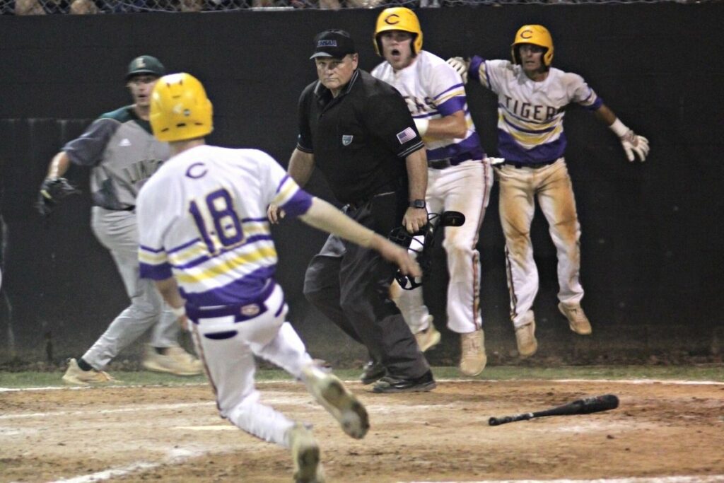 Columbia's Brynton Edge (18) ties the score at 6-6 in the bottom of the seventh inning against Lincoln on Monday.