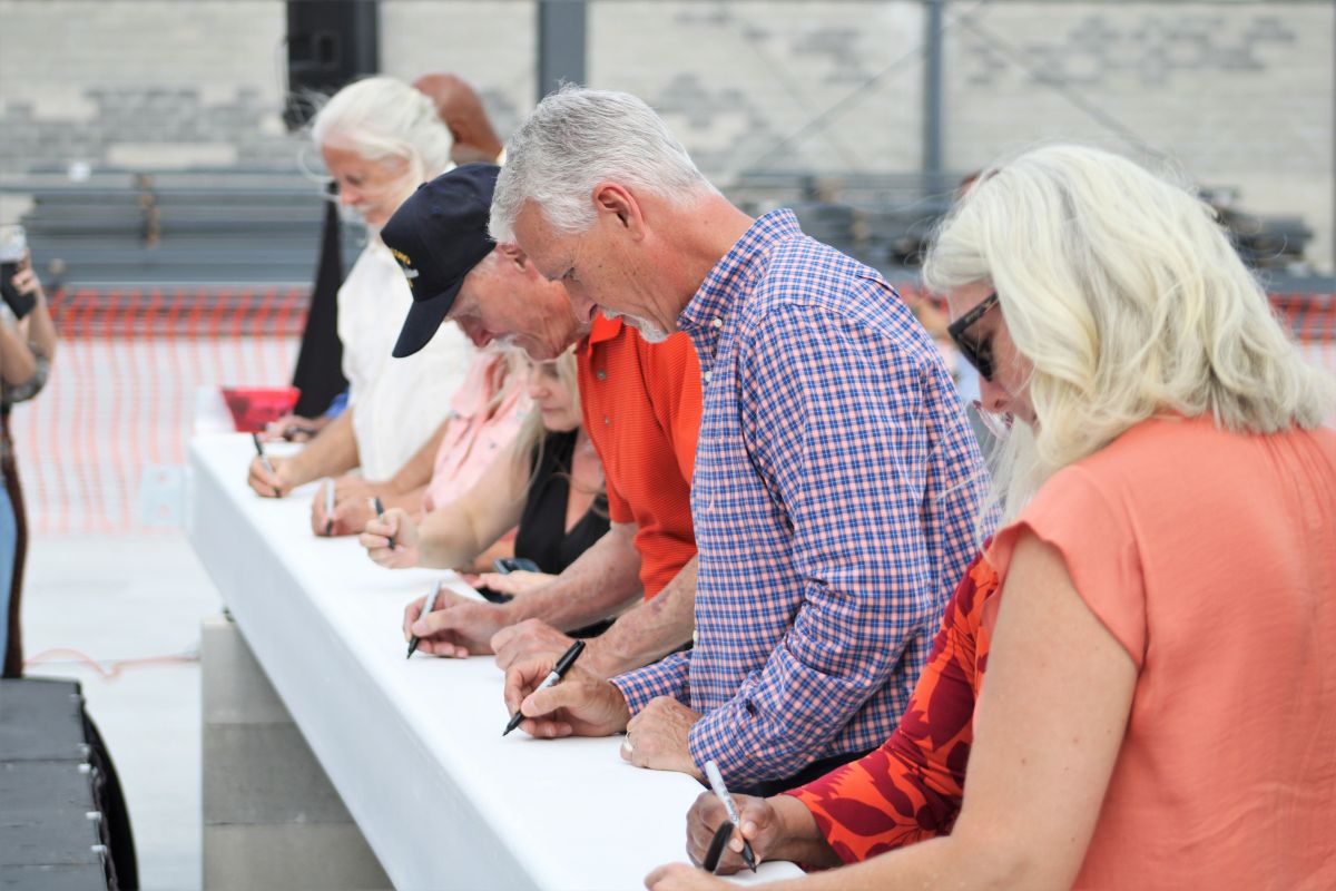 State Sen. Keith Perry signs steel beam