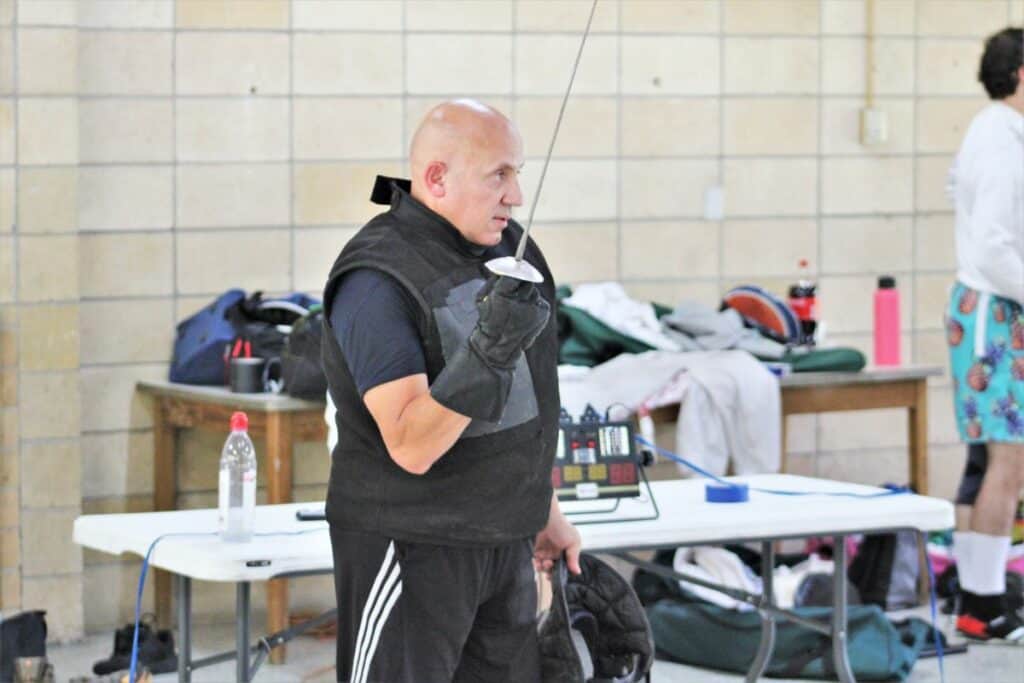 Julio Diaz coaches fencing