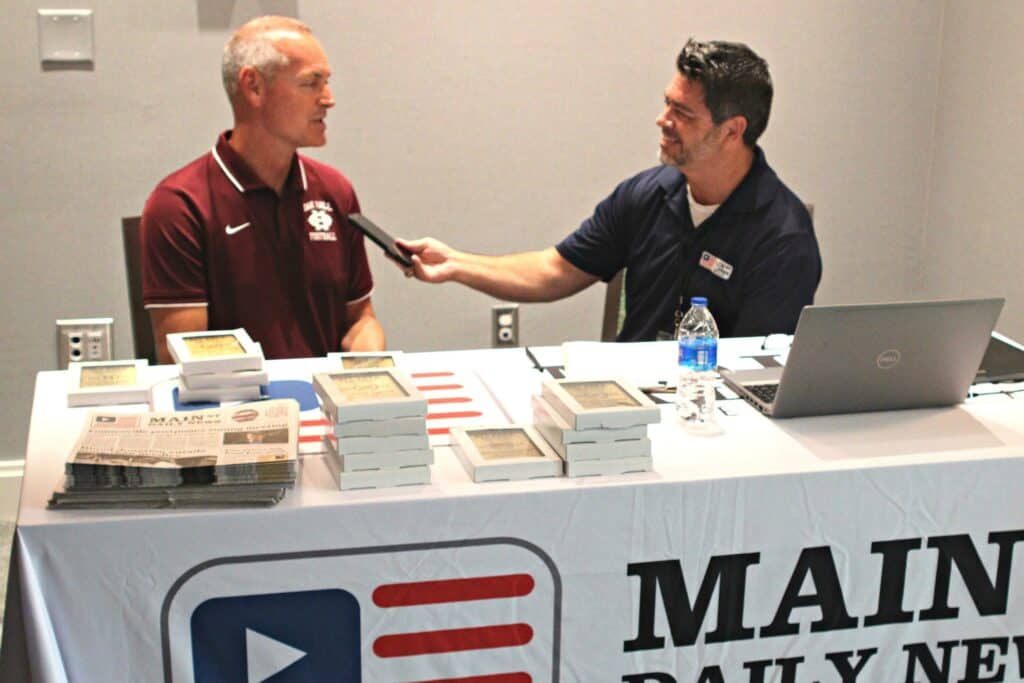 Oak Hall football coach RJ Fuhr and Mike Ridaught at Meda Day