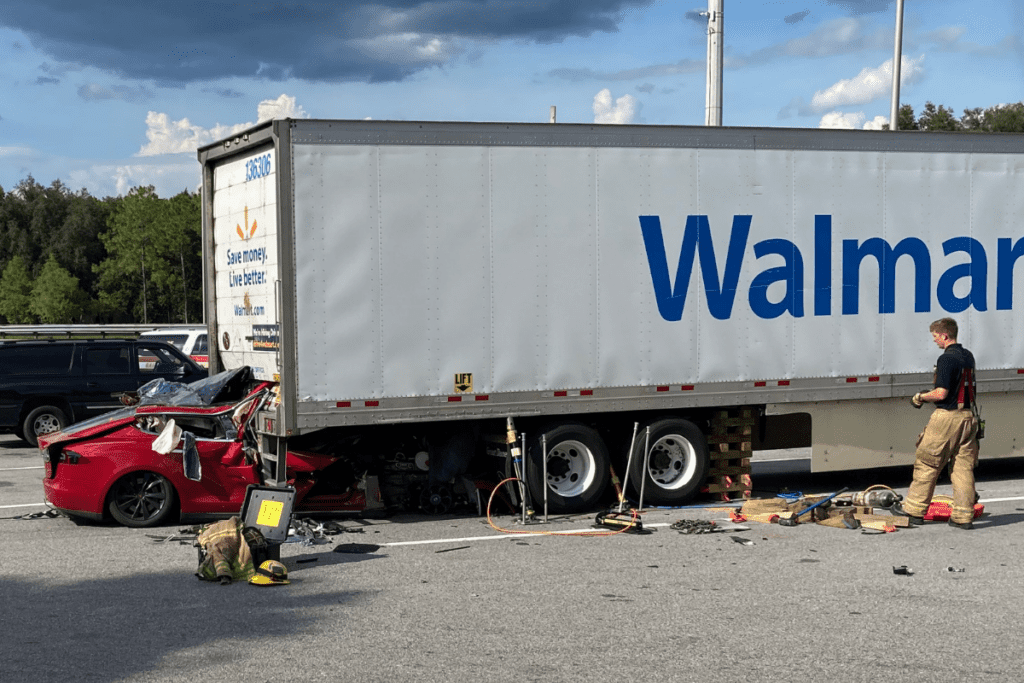 Tesla collides with parked tractor trailer at rest area