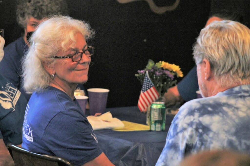 Alachua County Chair Marihelen Wheeler talks with attendees of an election watch party on Tuesday.