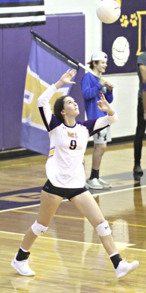 Bell volleyball Amani Salem serving