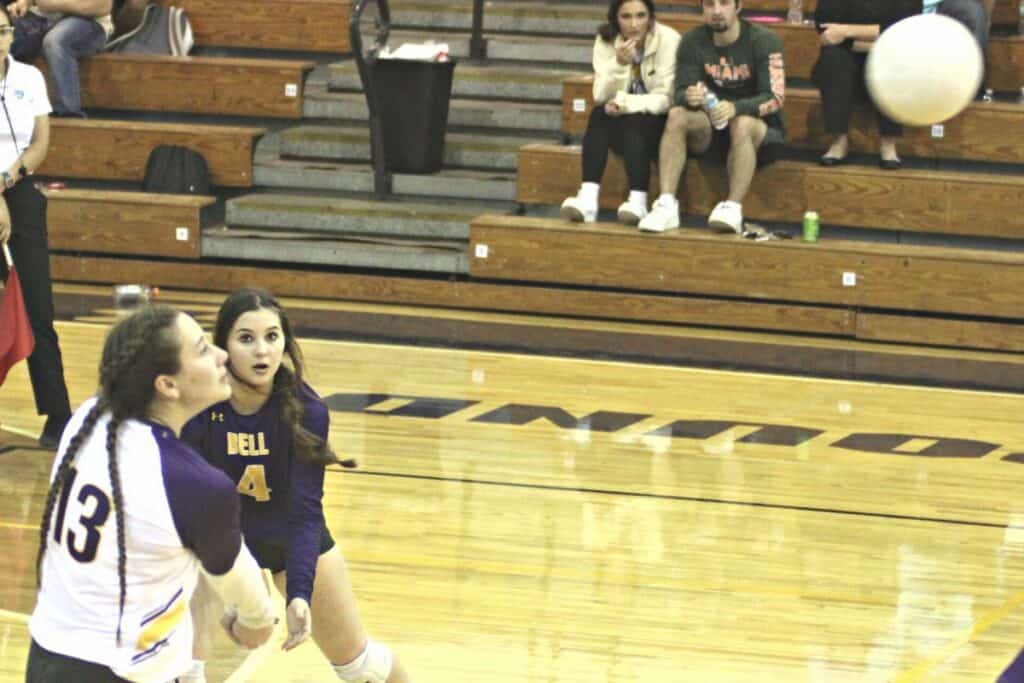 Bell volleyball Sydney Waddle (13) and Karys York (4) return