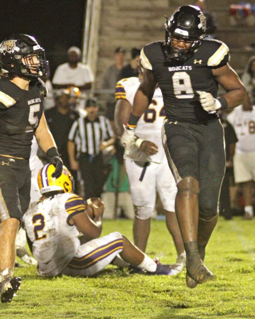Buchholz's Kendall Jackson celebrates after tackling Columbia's Tony Fulton in the backfield