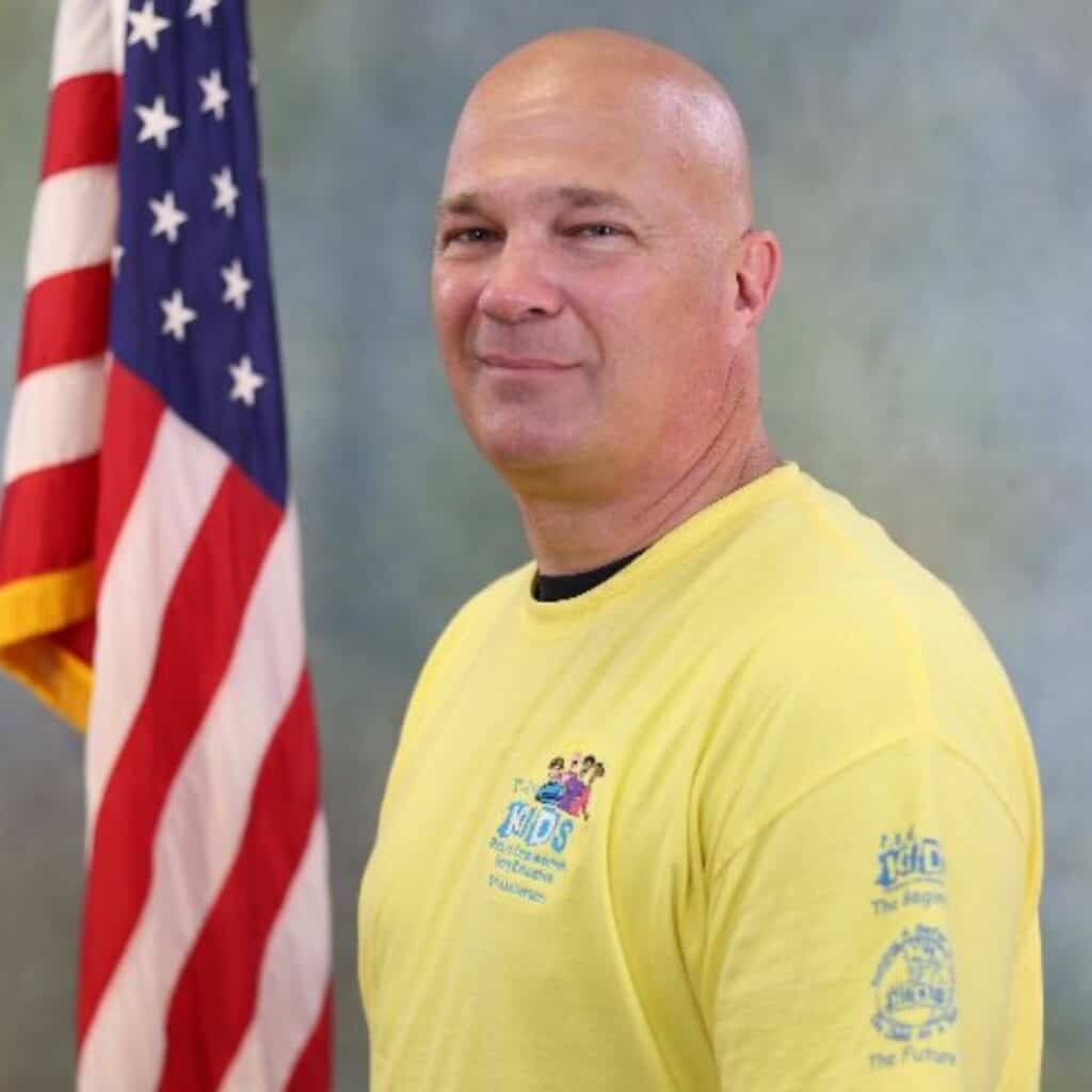 Cary Gallop serves as Florida Regional Director and a school resource officer at Idylwild Elementary School.