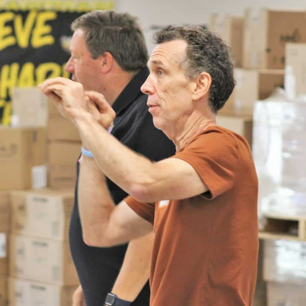 Dr. Tom Nelly, a music teacher at Idylwild Elementary School, practices the physical exercises that instructors run with radKIDS.