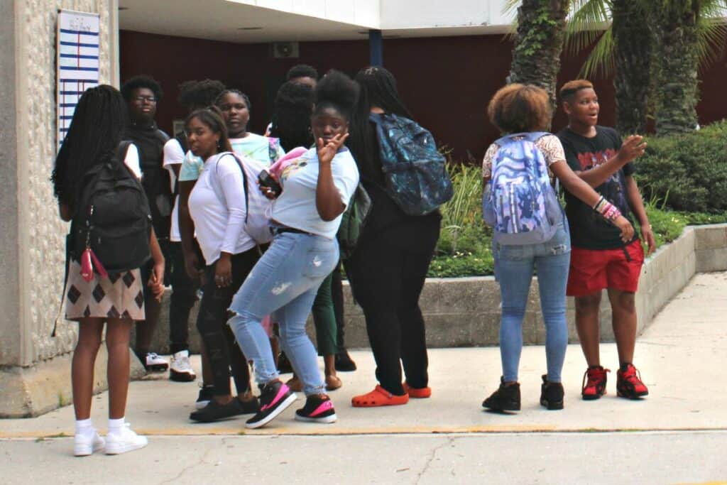 Fort Clark Middle School students talking outside