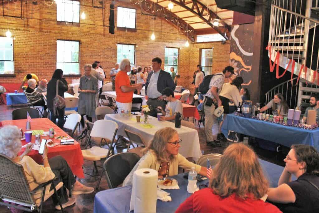 Supporters mingle with candidate at an election watch party for Danielle Hawk and David Arreola.