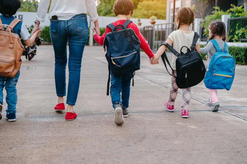 Mother walking children