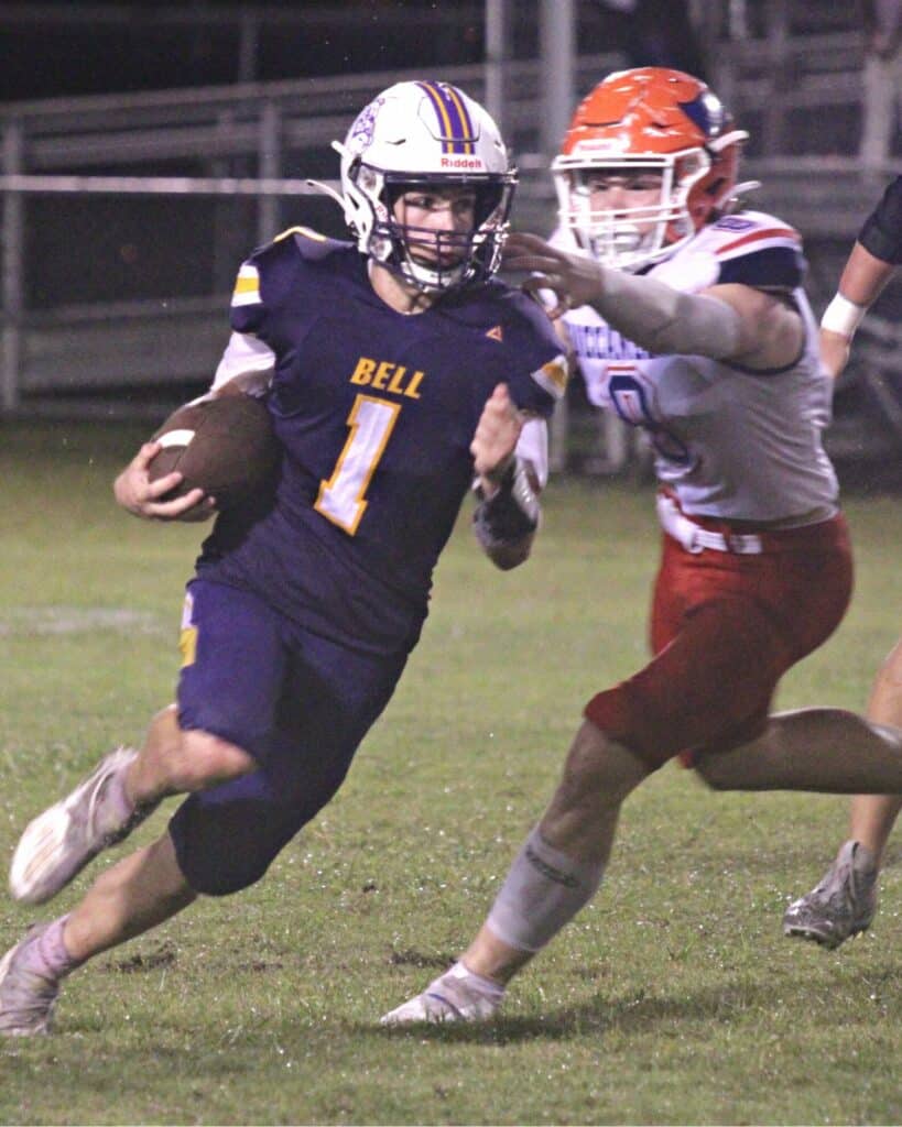 Branford's Trevor Maddox chases down Bell's Connor Hastings.