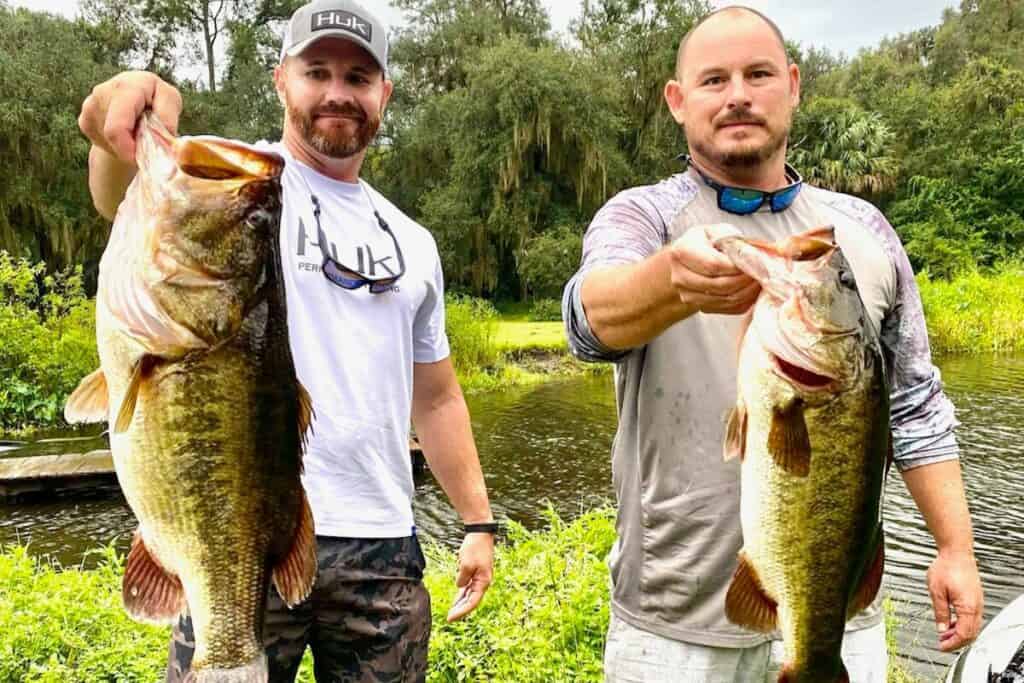 Joe Yarborough (left) and Dewayne Moore with two of their Orange Lake whoppers