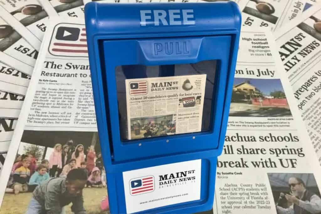 Mainstreet Daily News box with newspaper background