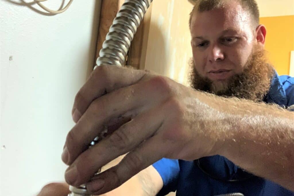 Master plumber Cyle Dunaway of Fletcher Plumbing, Inc. has installed 150 hot water heaters for GRU’s LEEPplus .