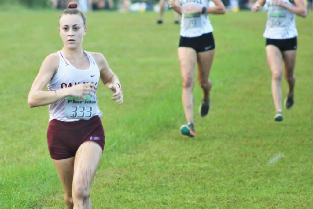 Oak Hall's Sydney Miller runs at the Bobcat Classic Invite. (1)