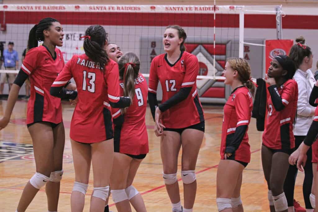 Santa Fe volleyball players dance to I Wanna Dance With Somebody before the third set of their 3-0 win over FSU High on Thursday.