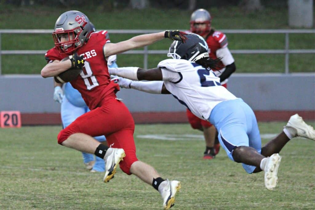 Santa Fe's Blake McCoy makes a first half reception against P.K. Yonge's Jammel Gillins.